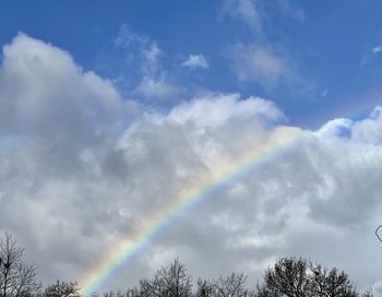 Low angle view of rainbow against sky