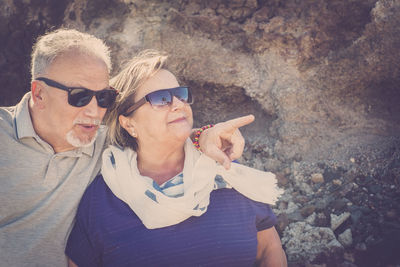 Close-up of couple against rock formation