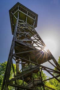 Low angle view of wood structure against sky 