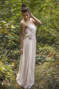 Portrait of young woman standing outdoors