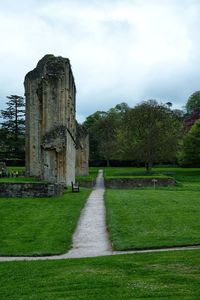 Built structure on field against sky