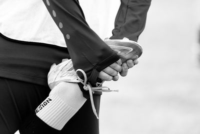 Midsection of man holding hands