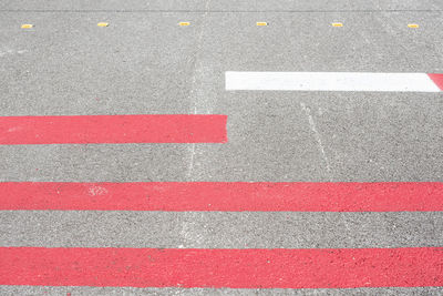 High angle view of arrow symbol on road in city