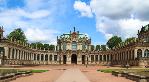 View of old building against cloudy sky