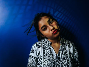 Close-up portrait of teenage girl making face