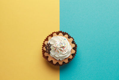 Directly above shot of cake against blue background