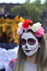 Portrait of woman with red flowers