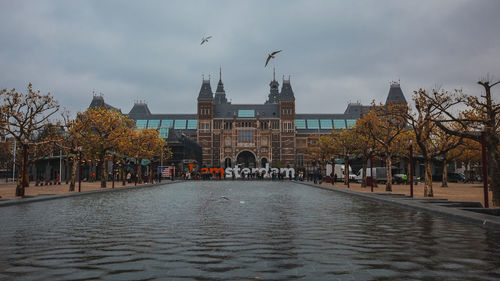 View of buildings in city against sky