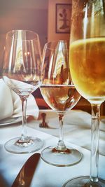 Close-up of wineglasses served on dining table in restaurant