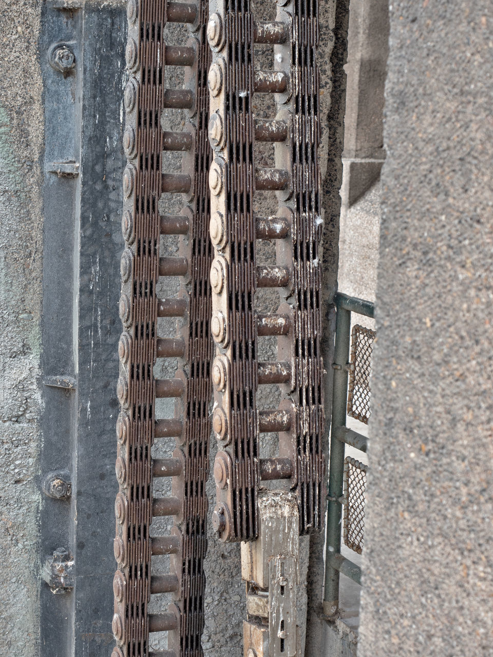 HIGH ANGLE VIEW OF METALLIC STRUCTURE ON STREET