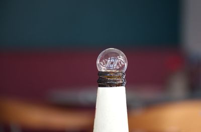 Close-up of glass bottle on table