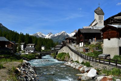 Panoramic view of buildings and mountains against sky