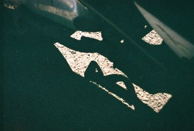 High angle view of arrow sign on road