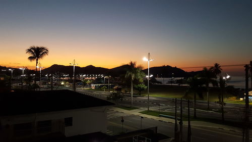 View of swimming pool at sunset