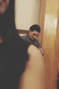 Young man sitting at home