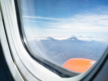Scenic view of mountains seen through window