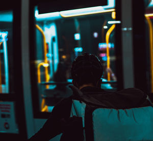 Rear view of man in train