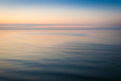 Scenic view of sea against sky at sunset