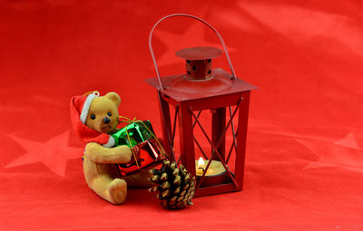 Stuffed toy on red table