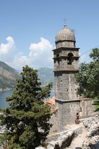 Tourists against clear sky