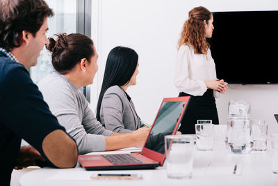 View of business person sitting at office