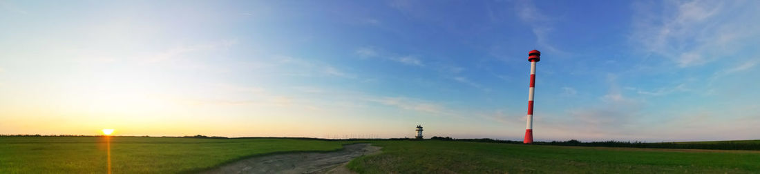 Scenic view of field against sky during sunset