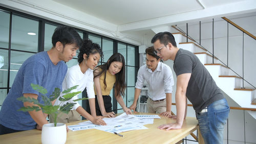 Young couple working on table