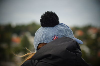 Rear view of woman standing outdoors