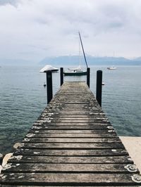 Pier over lake and mountain 