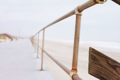 Close-up of pier against sky