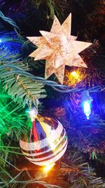 Close-up of illuminated christmas tree at night