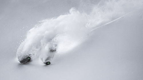 Man skiing on snowcapped mountain