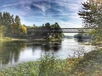 Bridge over river against sky