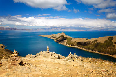 Panoramic view of sea and mountains against sky