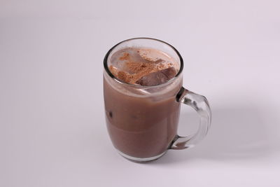 Close-up of coffee cup against white background