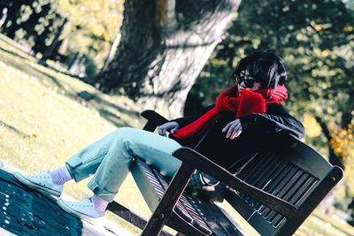 Portrait of young woman sitting outdoors