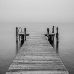 Pier over sea against clear sky