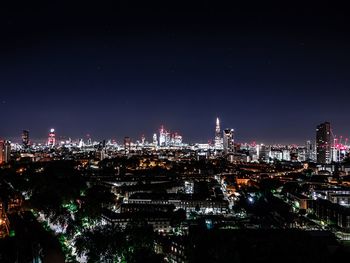 Illuminated buildings in city at night