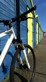 Bicycle parked on railing by street