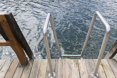 High angle view of railing in sea