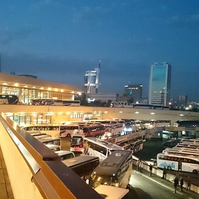 building exterior, architecture, built structure, city, illuminated, sky, cityscape, transportation, night, skyscraper, high angle view, modern, blue, development, building, city life, office building, outdoors, no people, tall - high