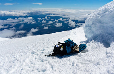  snow against mountain above clouds 