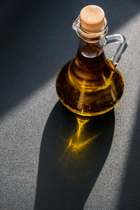 High angle view of glass bottle on table