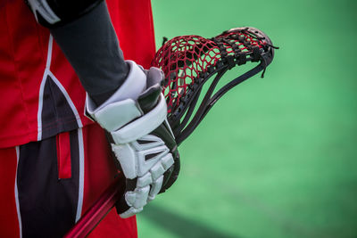 Close-up of sportsperson holding racket