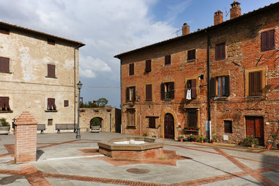 Buildings and walkway against sky