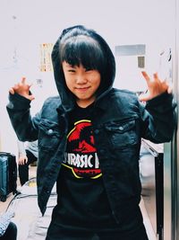 Portrait of happy girl holding camera