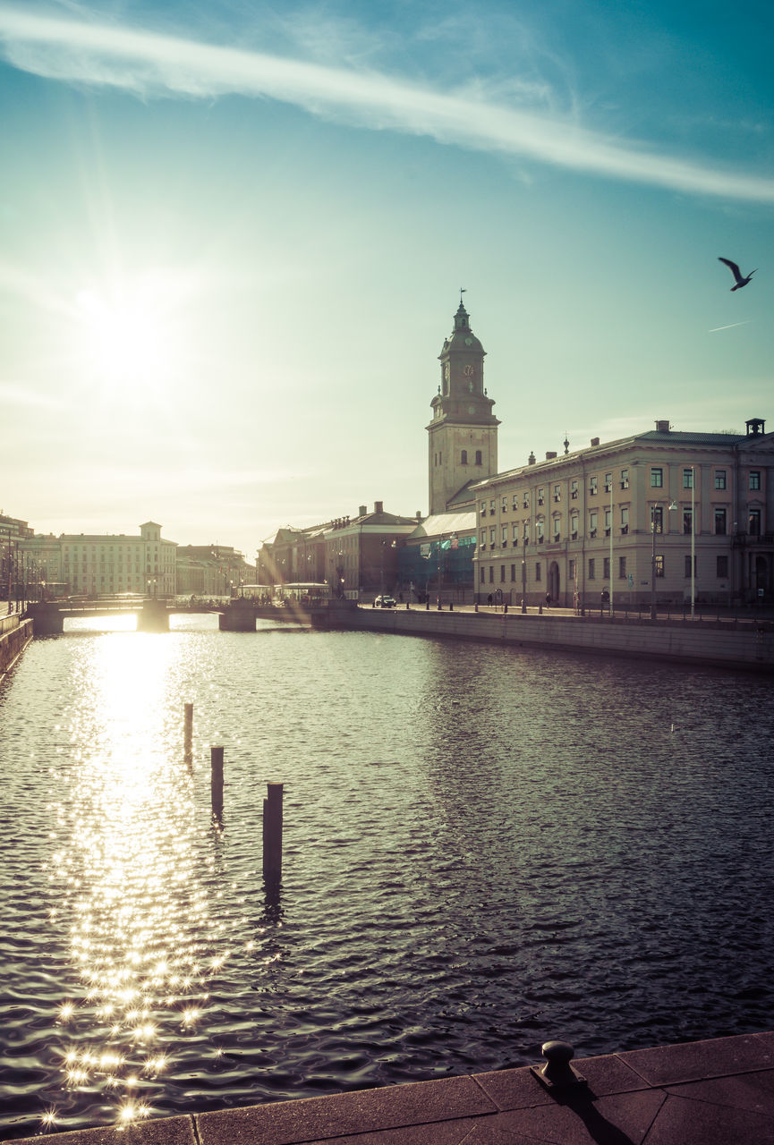 VIEW OF BUILDINGS BY RIVER