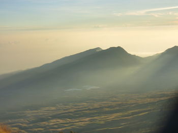 Scenic view of mountains against sky during sunset