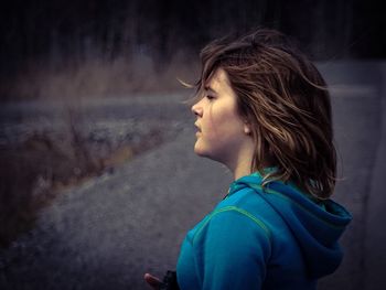 Side view of young woman