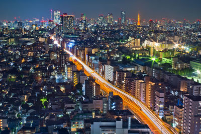 High angle view of illuminated buildings in city at night